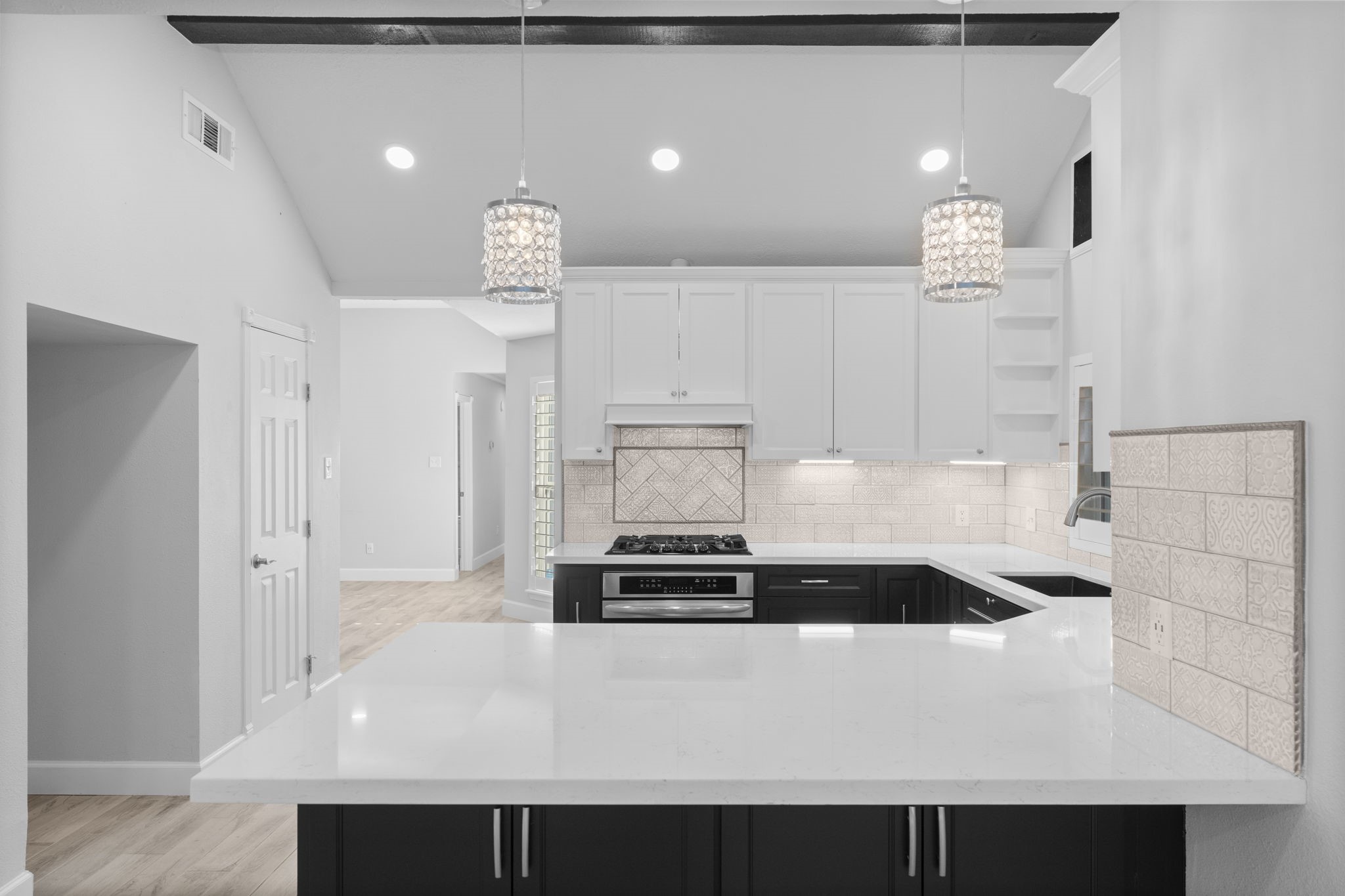 22 Shady Oak Lane Conroe, TX 77304 - Photo 14 of 44 a kitchen with a sink and white cabinets