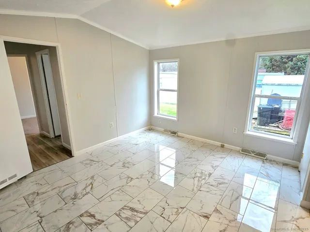 a view of a room with a large window