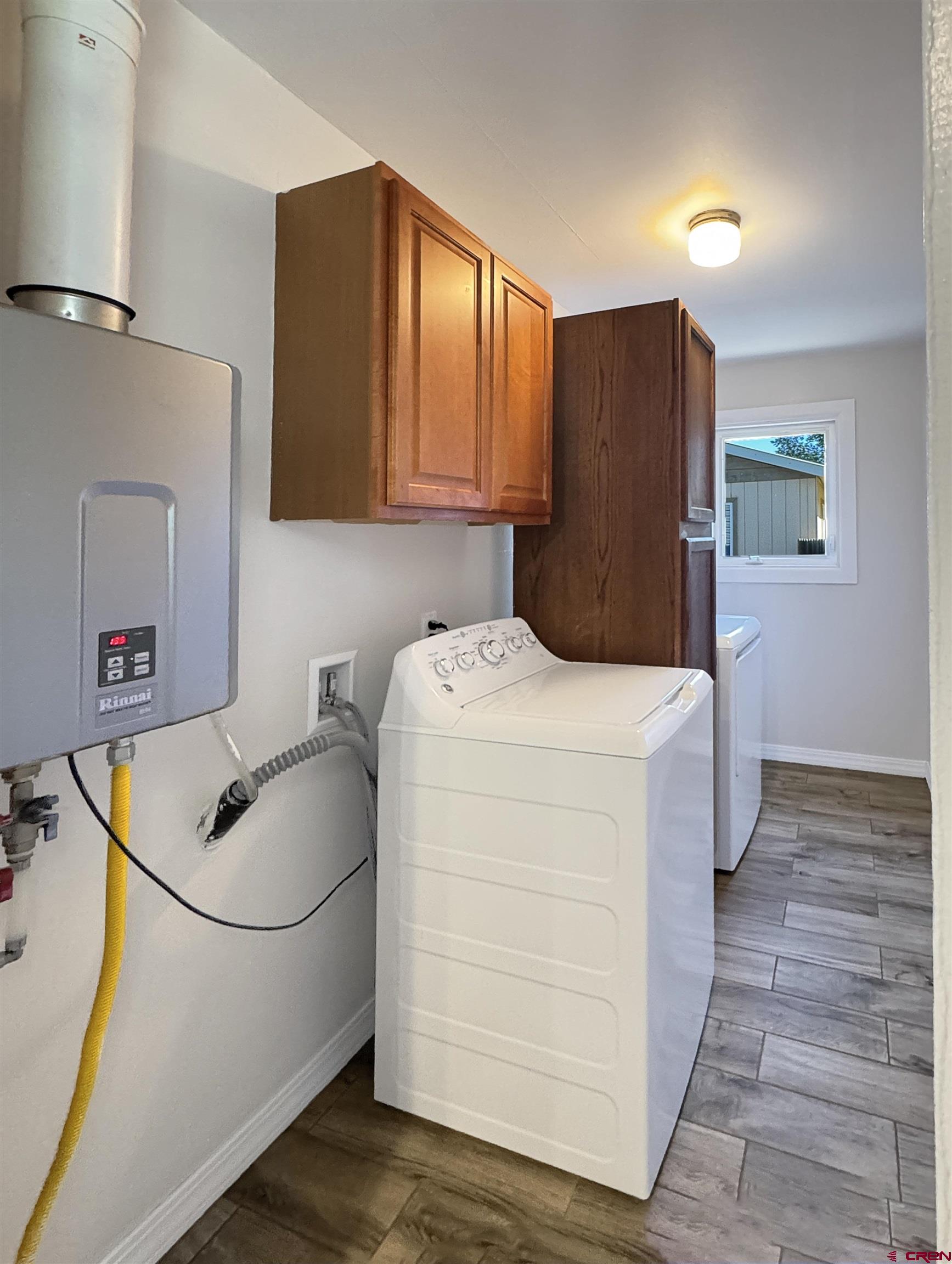219 Edith Street Cortez, CO 81321 - Photo 11 of 29 a utility room with dryer and washer