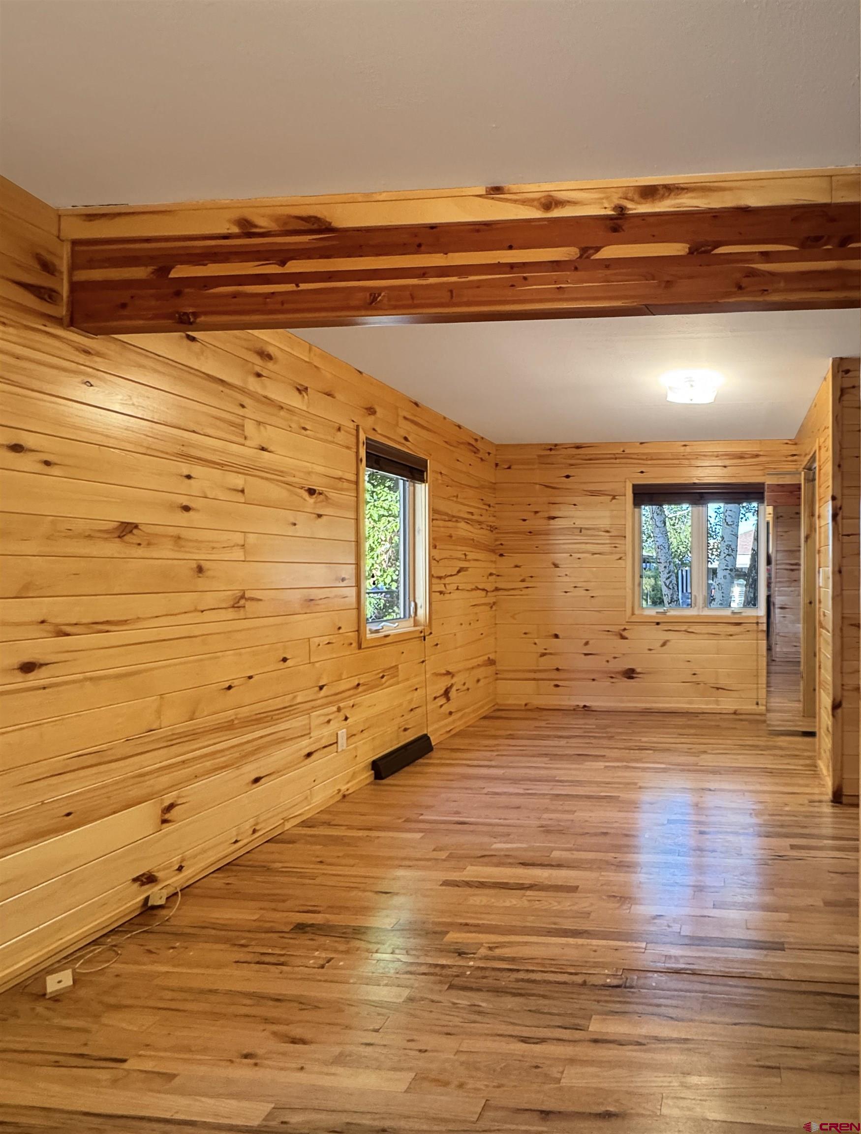 219 Edith Street Cortez, CO 81321 - Photo 21 of 29 a view of empty room with wooden floor