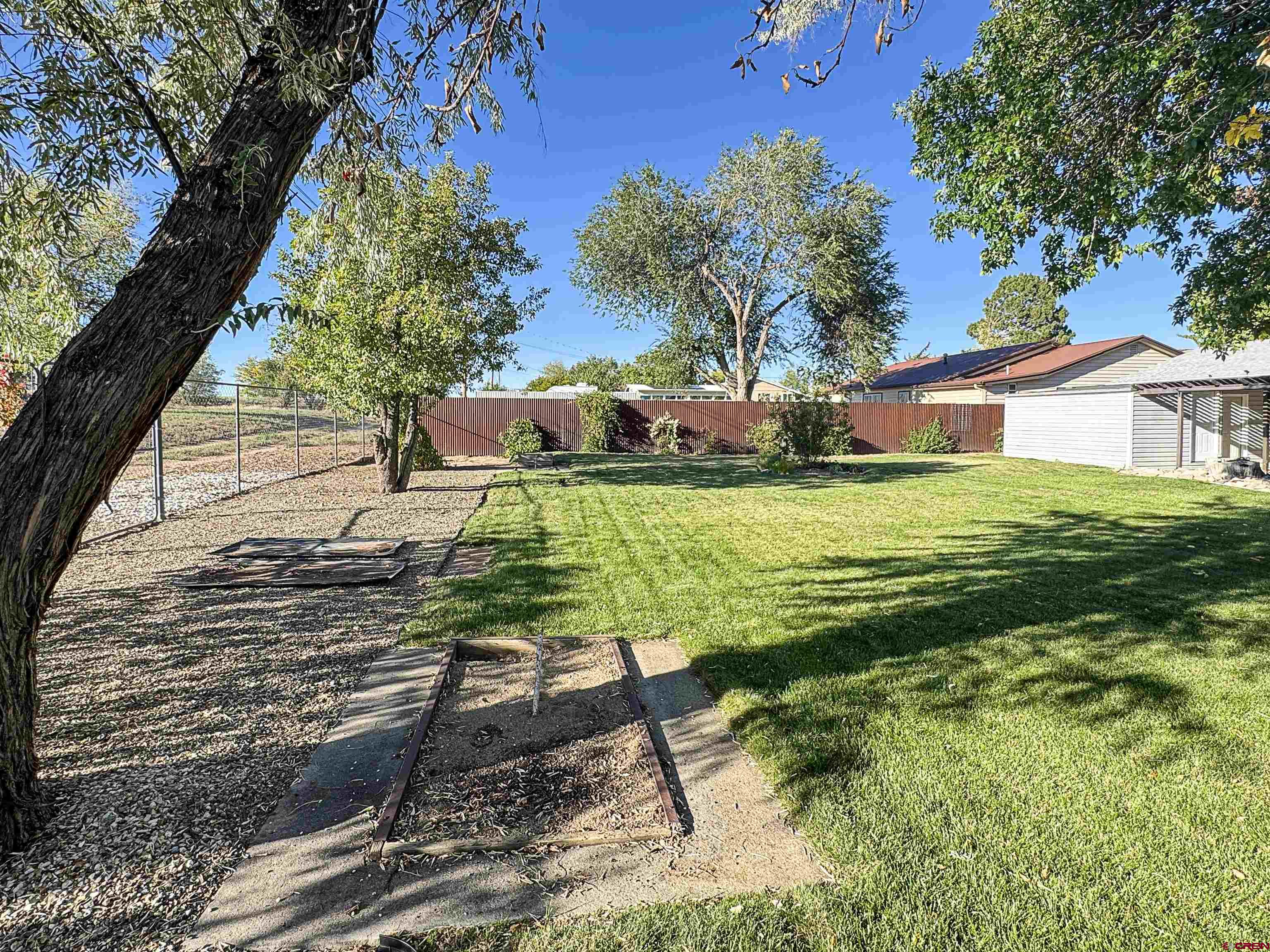 219 Edith Street Cortez, CO 81321 - Photo 28 of 29 a view of a backyard with sitting area