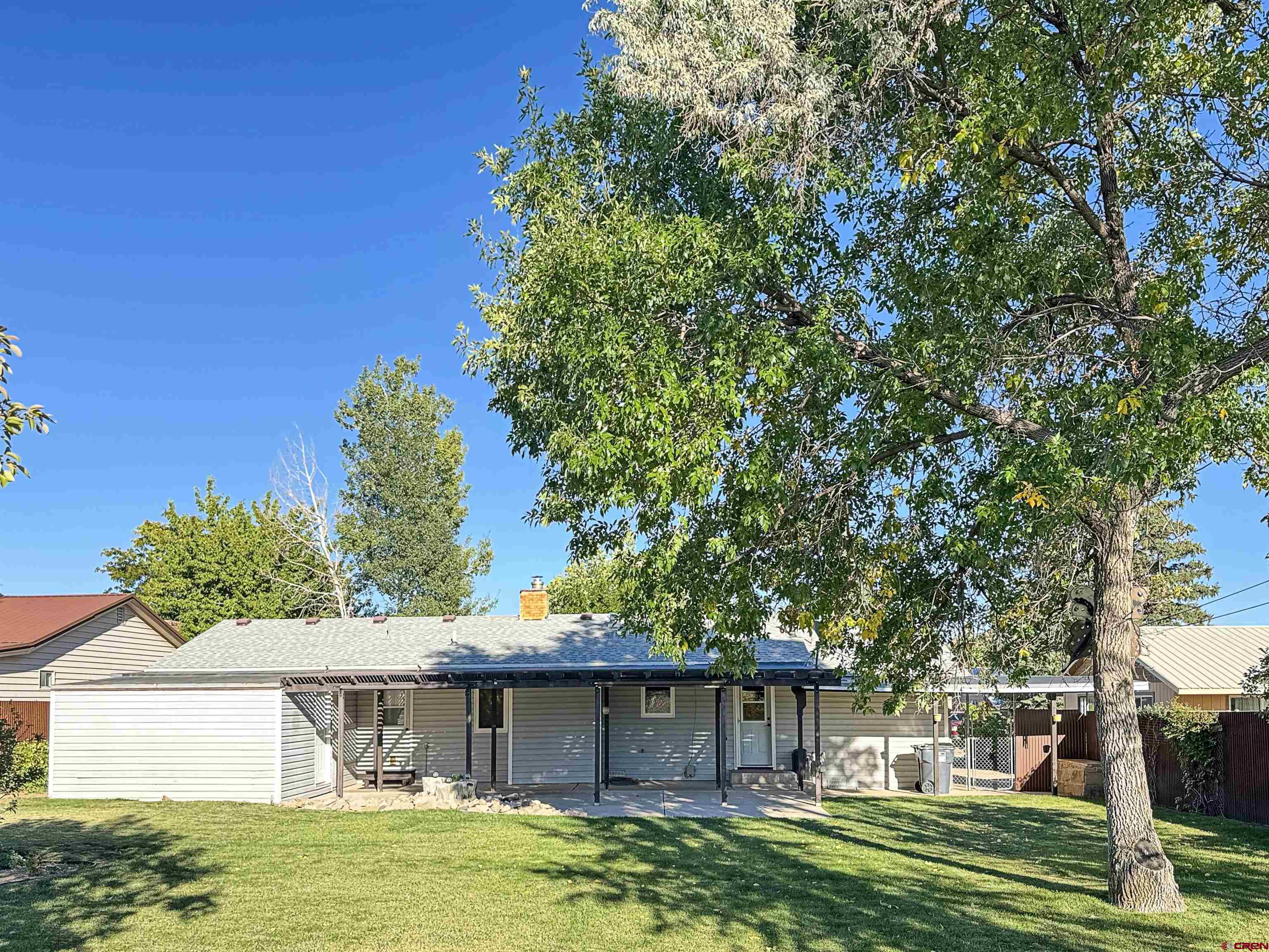 219 Edith Street Cortez, CO 81321 - Photo 29 of 29 a front view of a house with a garden