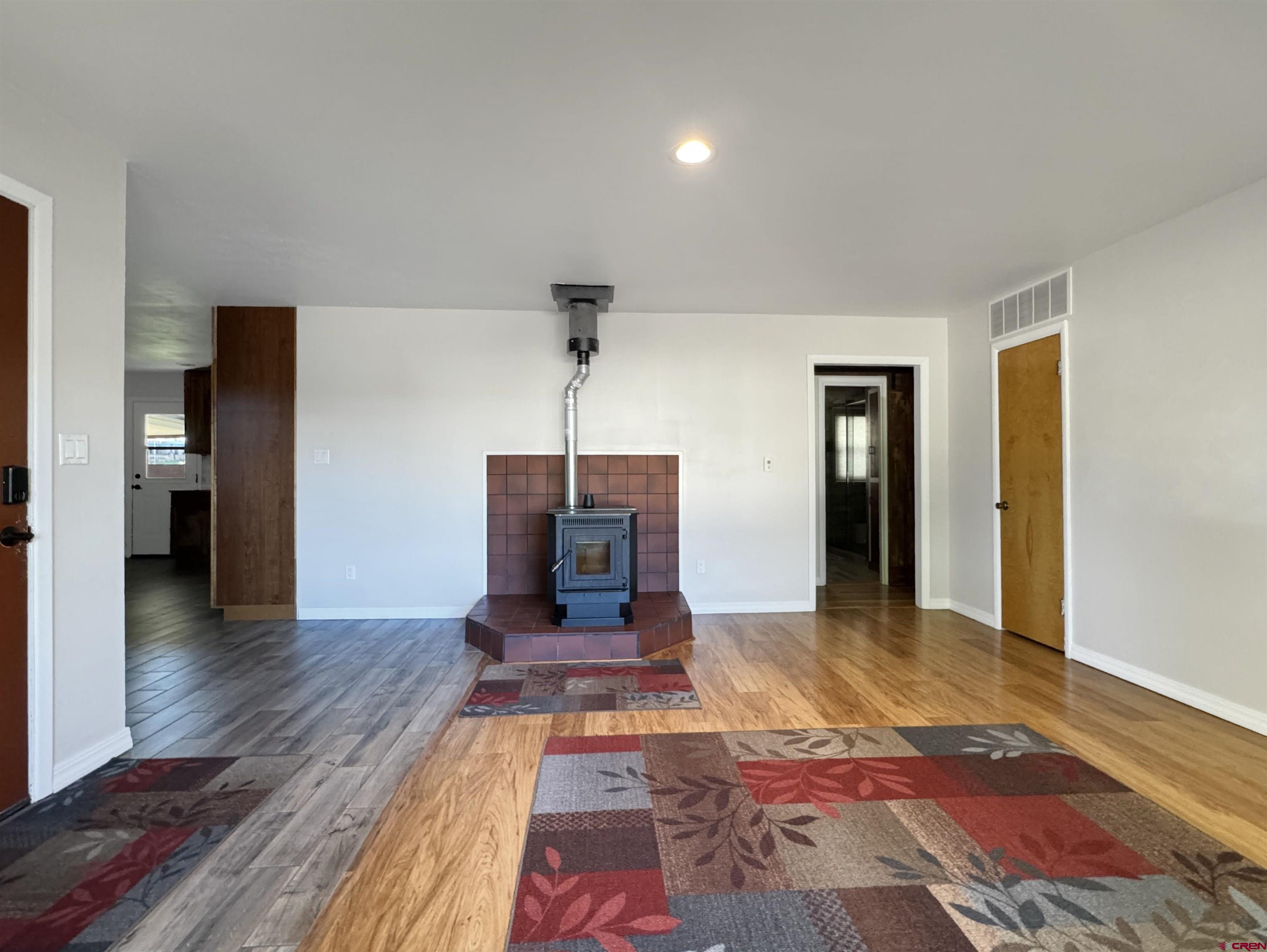 219 Edith Street Cortez, CO 81321 - Photo 6 of 29 a living room with furniture and a wooden floor