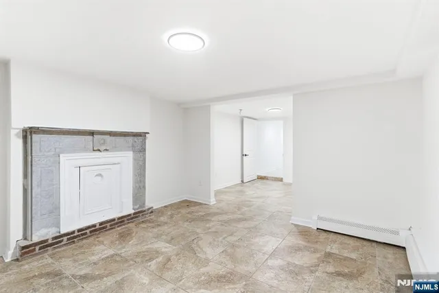 a view of an empty room and closet area