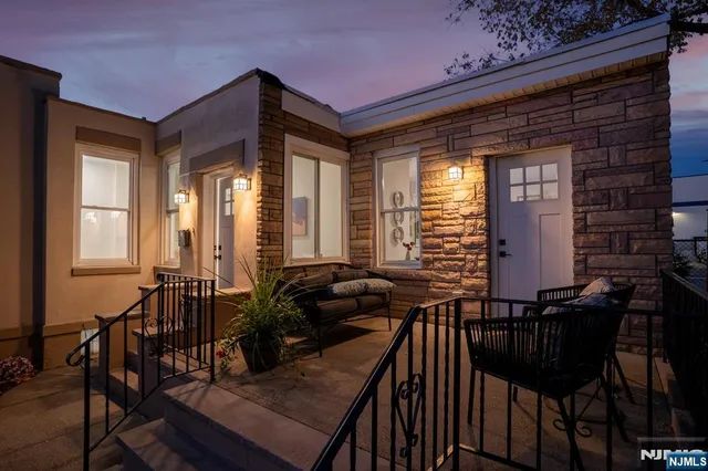a view of a dining room with furniture and window
