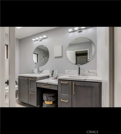 a view of living room with furniture and mirror
