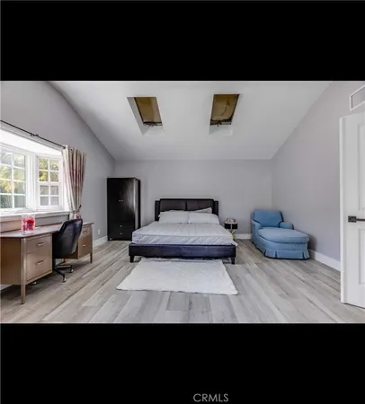 a view of living room with furniture and a window