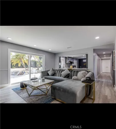 a living room with furniture window and a table