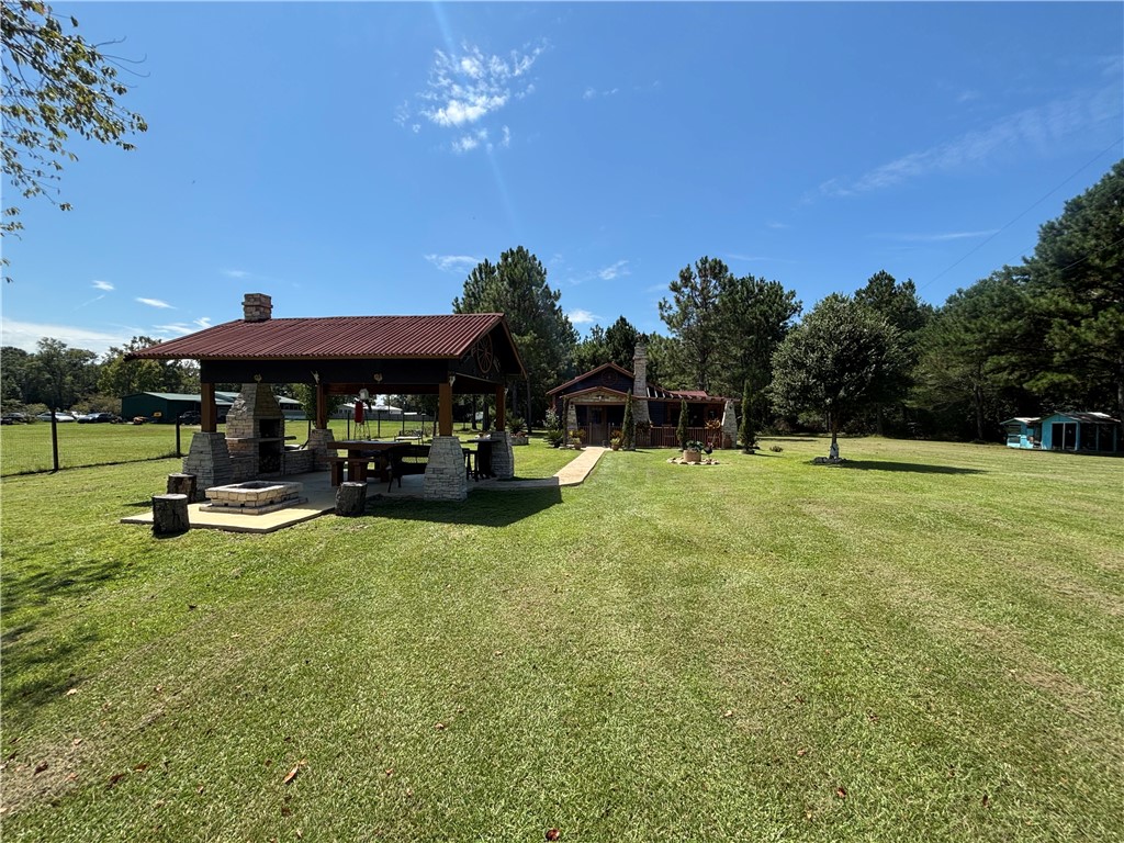 694 Overstreet Road Jesup, GA 31546 - Photo 13 of 23 Out door area with fire place and fire pit