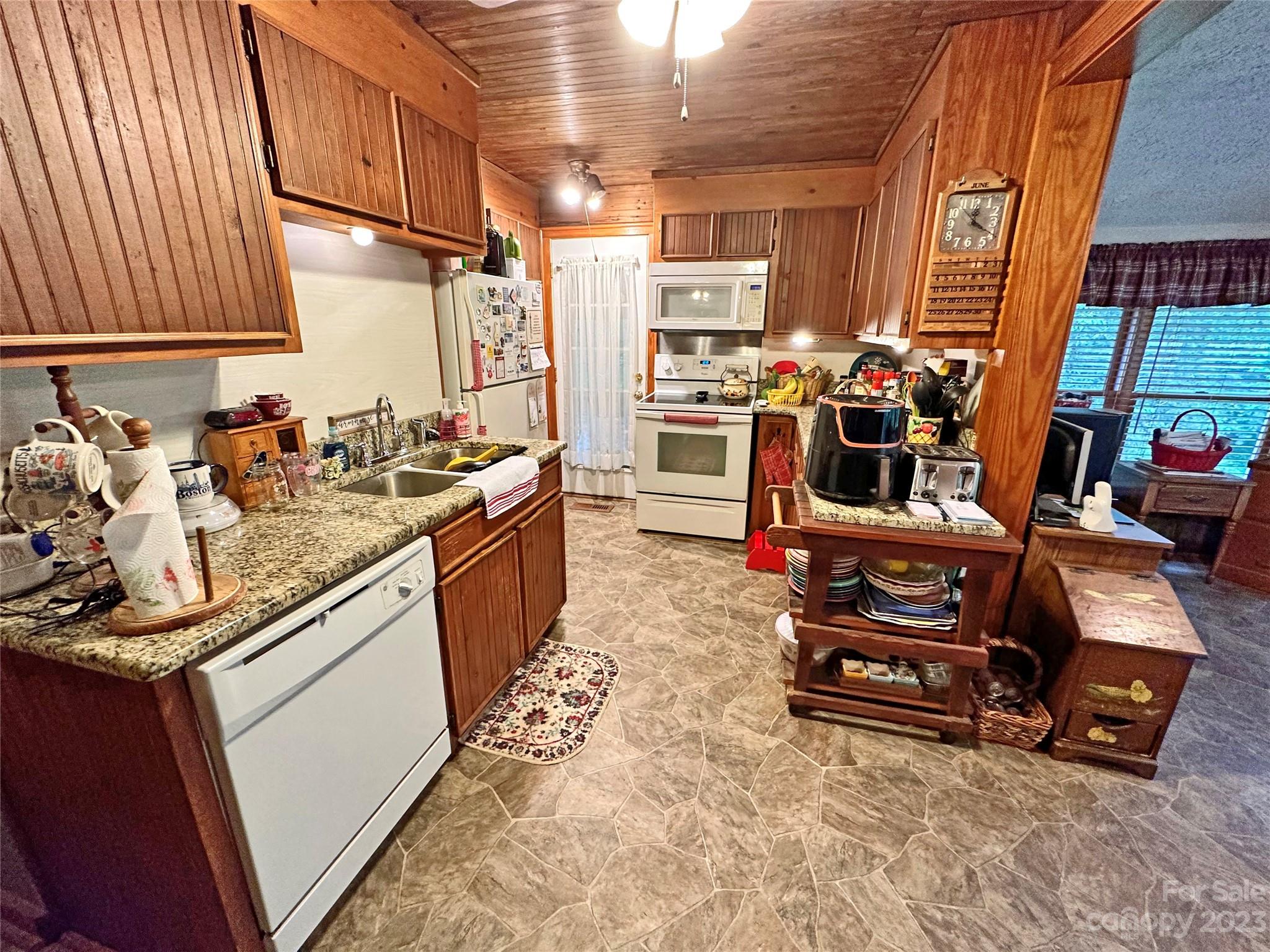 1151 Carpenters Grove Church Road Lawndale, NC 28090 - Photo 14 of 46 a kitchen that has a sink and a stove with wooden floor