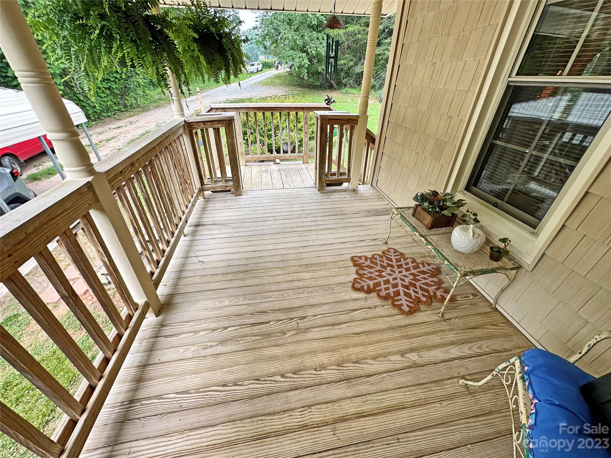 1151 Carpenters Grove Church Road Lawndale, NC 28090 - Photo 35 of 46 a view of a balcony with wooden floor and outdoor seating