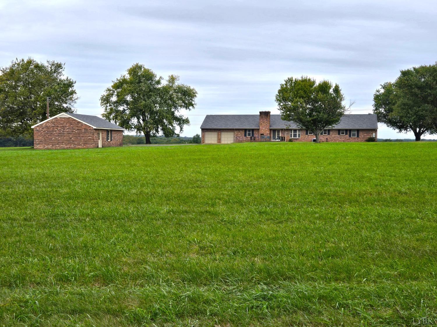 3049 Farmville Road Farmville, VA 23901 - Photo 1 of 26 a view of a house with a yard and a fountain