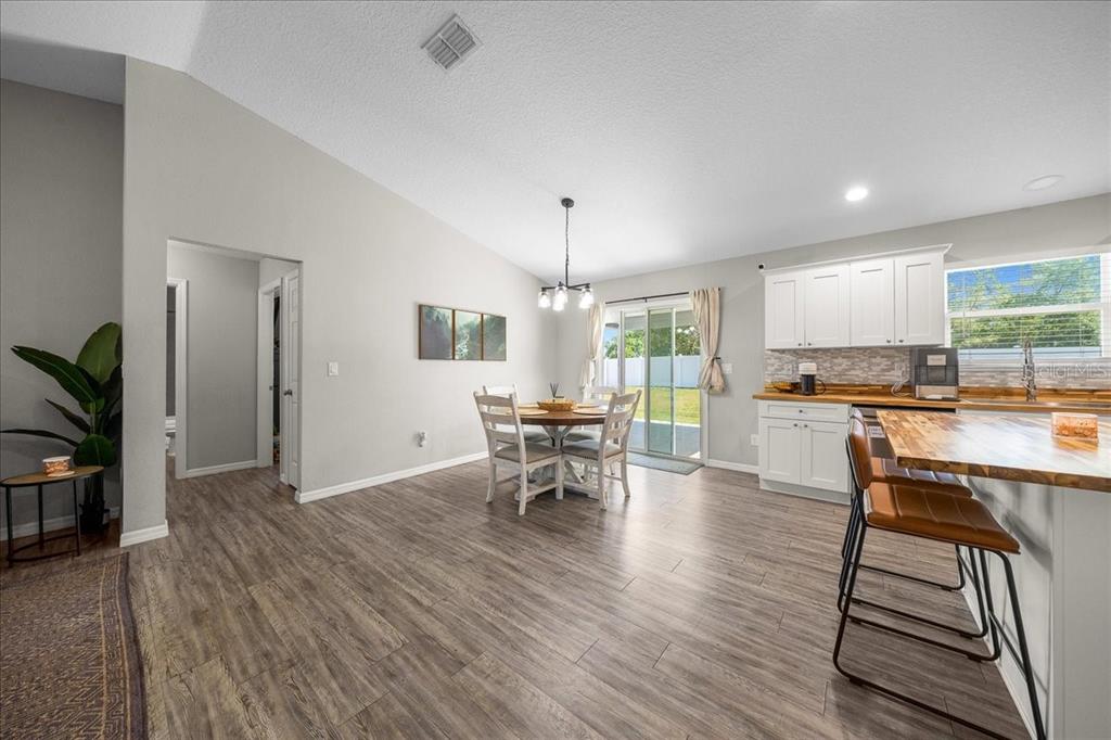 13 Teak Loop Place Ocala, FL 34472 - Photo 20 of 36 a view of a dining room with furniture window and wooden floor