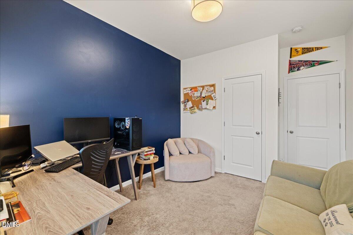 845 Oak Center Drive Raleigh, NC 27610 - Photo 19 of 29 a living room with furniture and a flat screen tv