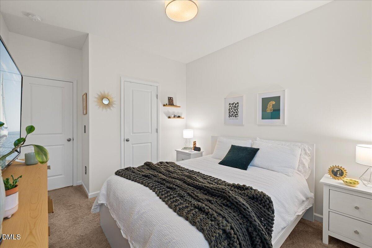 845 Oak Center Drive Raleigh, NC 27610 - Photo 21 of 29 a bedroom with a bed and hallway