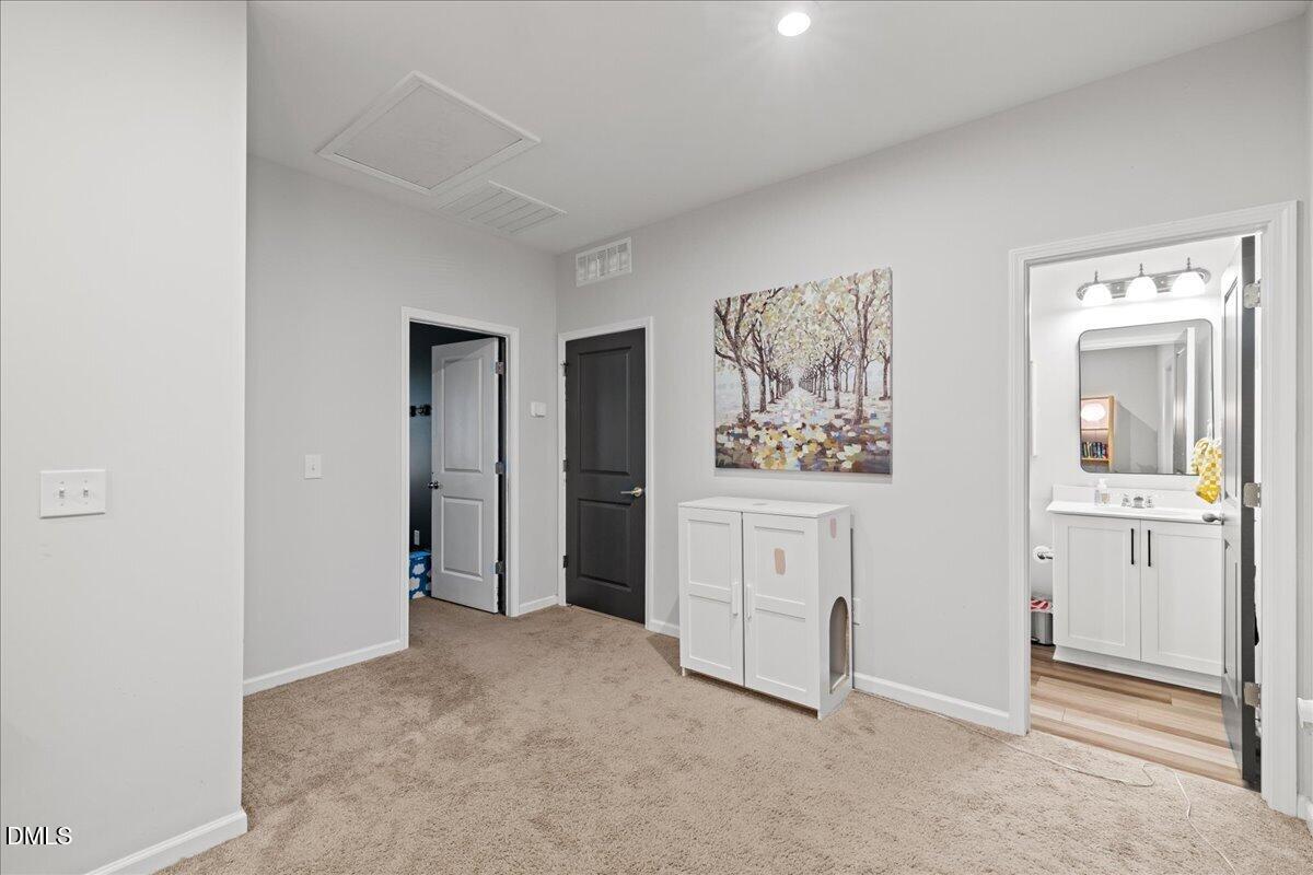 845 Oak Center Drive Raleigh, NC 27610 - Photo 23 of 29 an entryway with a cabinet and mirror