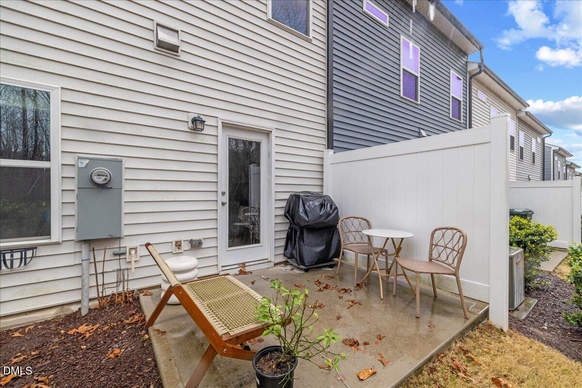845 Oak Center Drive Raleigh, NC 27610 - Photo 27 of 29 a view of a chair and table in backyard