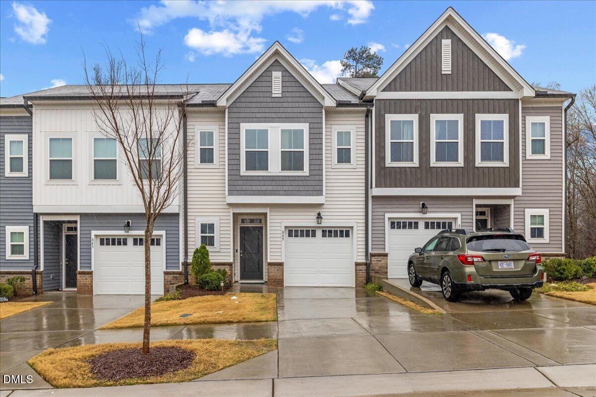 845 Oak Center Drive Raleigh, NC 27610 - Photo 2 of 29 a front view of a house with garden