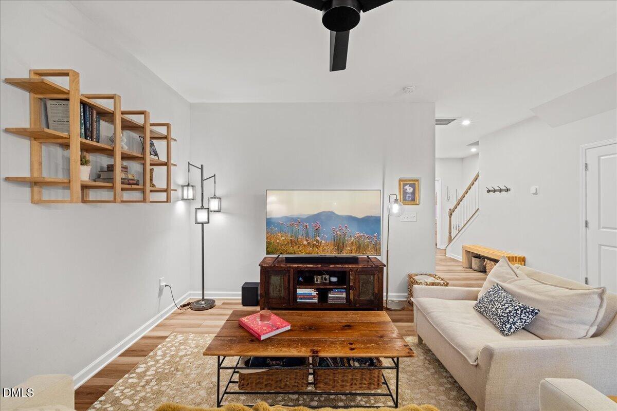 845 Oak Center Drive Raleigh, NC 27610 - Photo 6 of 29 a living room with furniture and a fireplace