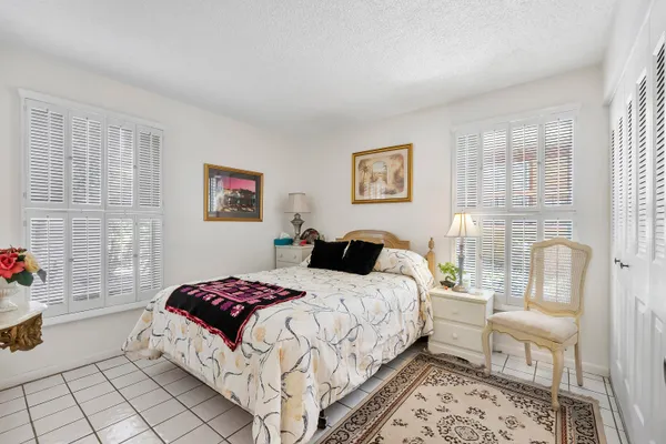 a bathroom with a sink mirror vanity and toilet
