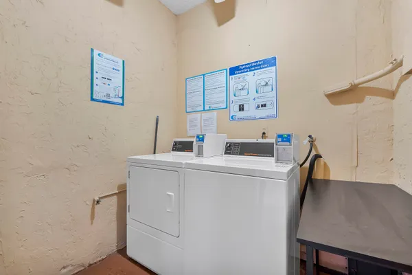 a view of a big room with windows and entryway