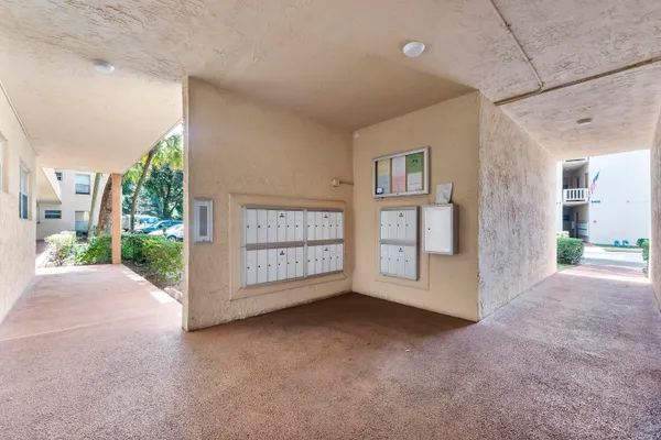 a view of a house with wooden fence