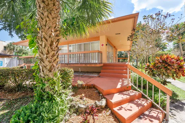 a swimming pool with outdoor seating and yard