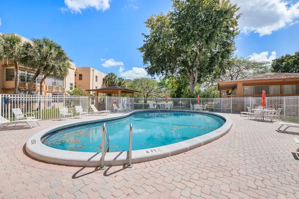 a view of a swimming pool with a patio