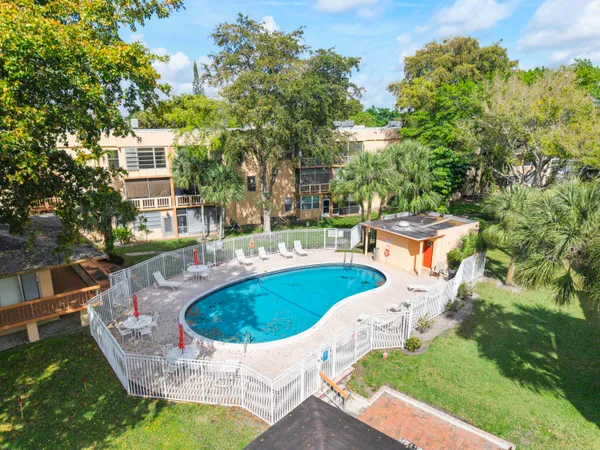 a view of a swimming pool with a patio