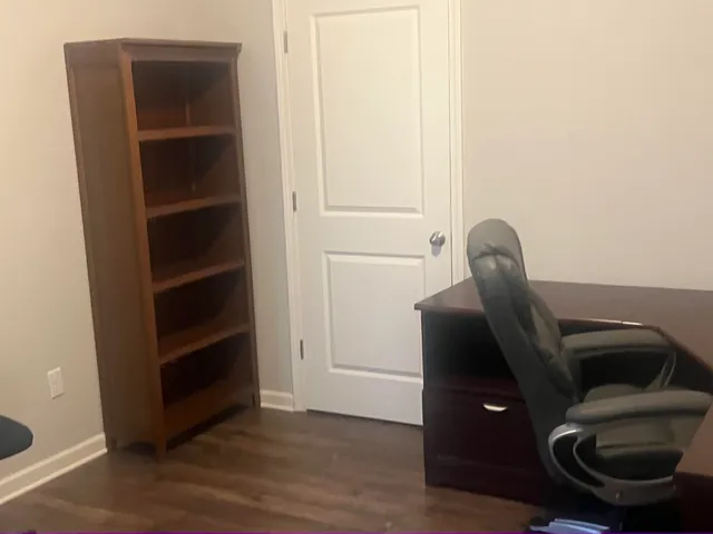 a view of workspace with wooden floor