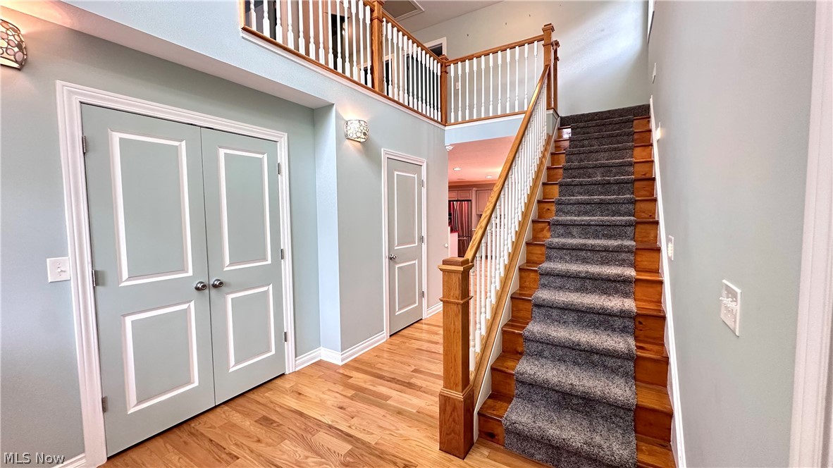 2603 Rockefeller Road Wickliffe, OH 44092 - Photo 3 of 34 Two-story entry featuring wood-finish flooring, a carpeted staircase with wood newel posts, and a second-story landing with white balusters