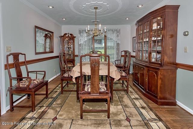 368 Maple Lake Road Moscow, PA 18444 - Photo 15 of 51 a view of a dining room with furniture wooden floor and chandelier