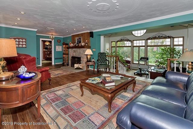368 Maple Lake Road Moscow, PA 18444 - Photo 2 of 51 a living room with furniture and a fireplace