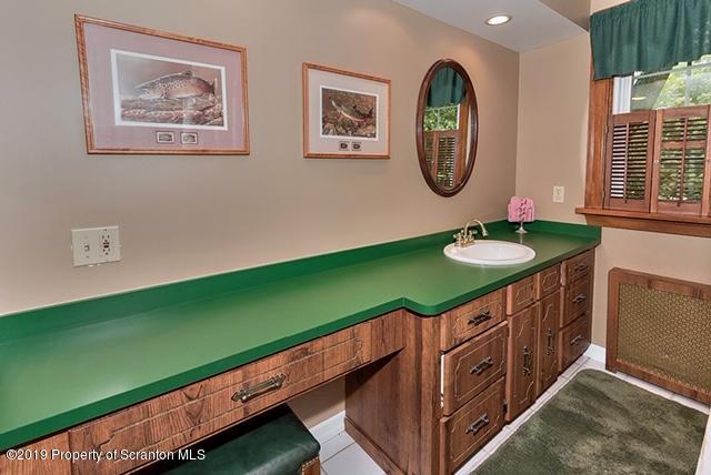 368 Maple Lake Road Moscow, PA 18444 - Photo 29 of 51 a bathroom with a sink and a mirror