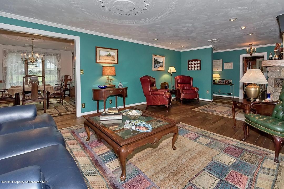 368 Maple Lake Road Moscow, PA 18444 - Photo 3 of 51 a living room with furniture a table and a potted plant