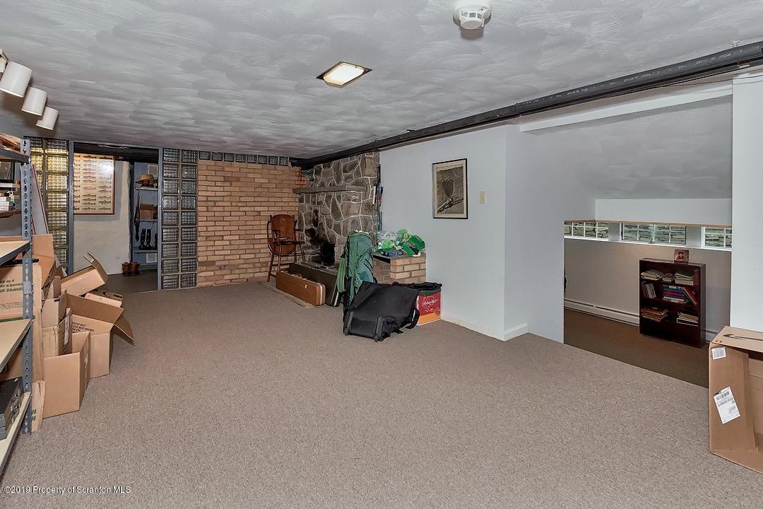 368 Maple Lake Road Moscow, PA 18444 - Photo 33 of 51 a room with gym equipment and a large window
