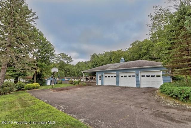 368 Maple Lake Road Moscow, PA 18444 - Photo 38 of 51 a front view of a house with a garden