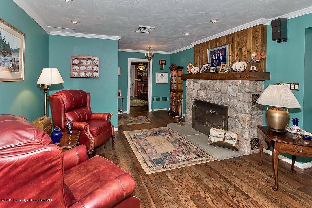 368 Maple Lake Road Moscow, PA 18444 - Photo 4 of 51 a living room with furniture and a fireplace