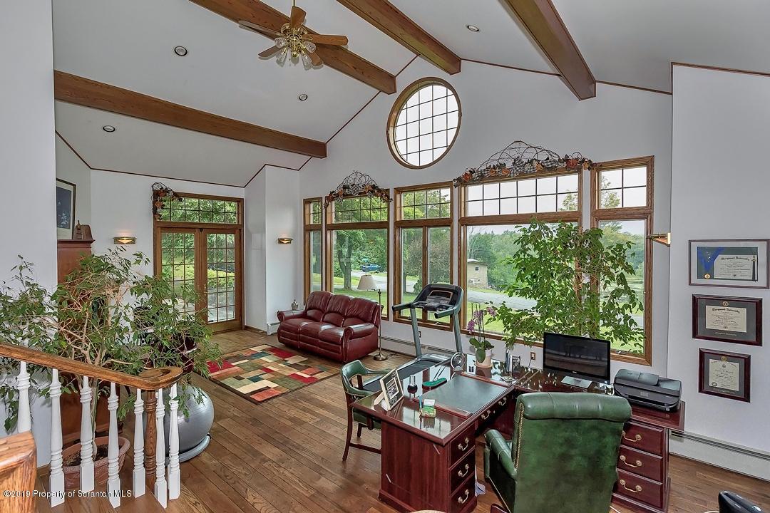 368 Maple Lake Road Moscow, PA 18444 - Photo 7 of 51 a living room with furniture a rug and a large window