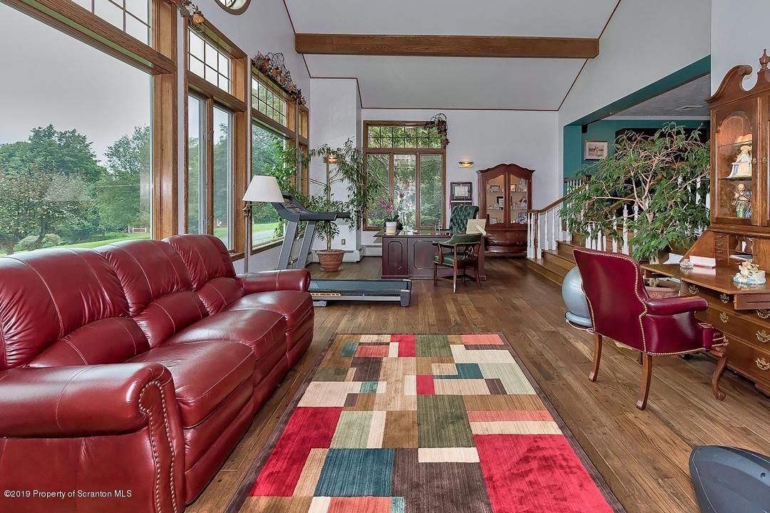 368 Maple Lake Road Moscow, PA 18444 - Photo 8 of 51 a living room with furniture and a rug