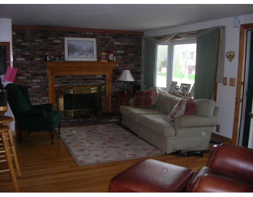 9 Walsh Road Holbrook, MA 02343 - Photo 11 of 19 a living room with furniture and a fireplace
