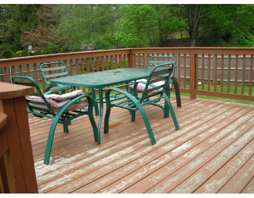 9 Walsh Road Holbrook, MA 02343 - Photo 7 of 19 a view of a chairs on wooden deck