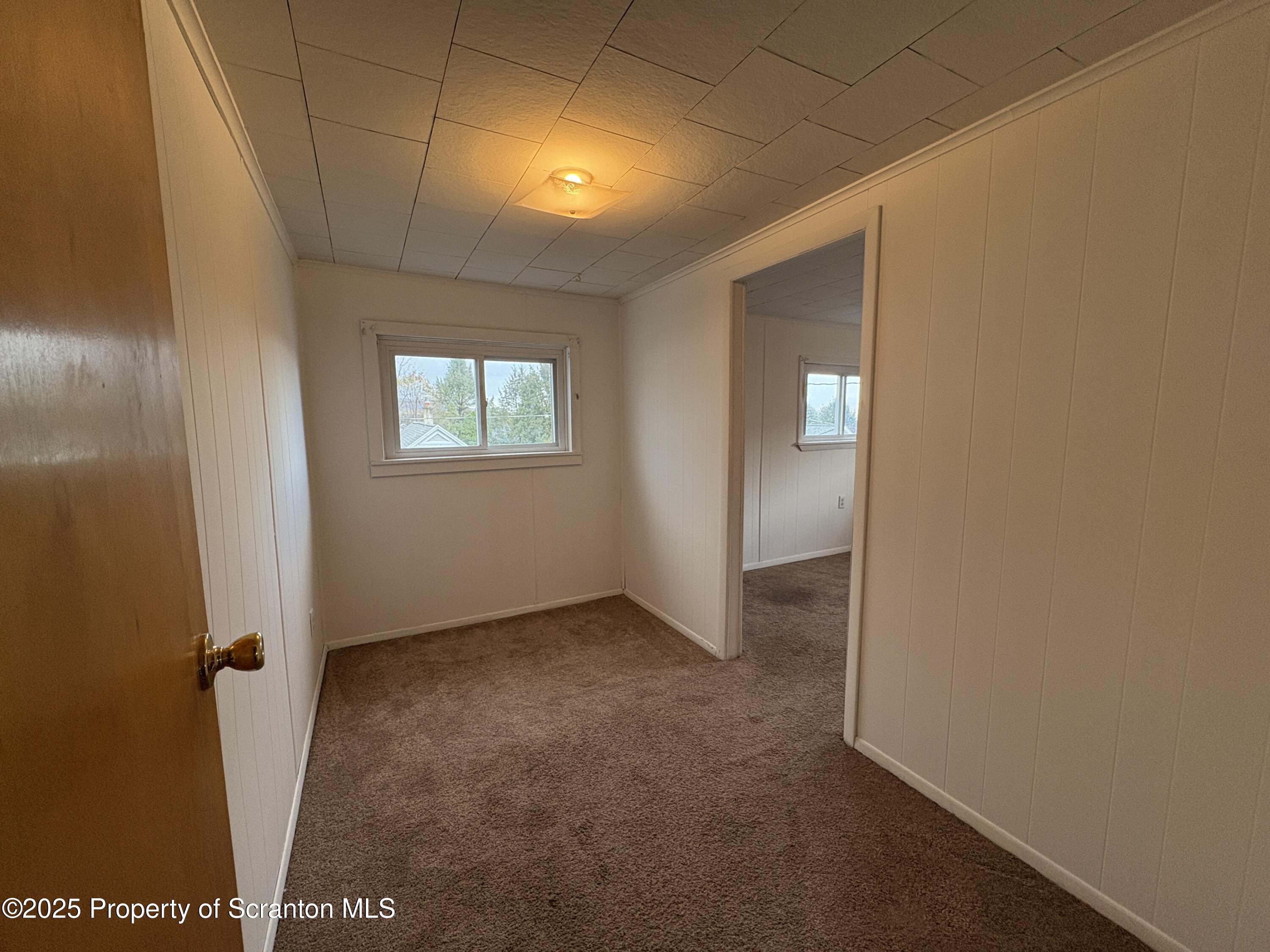 1819 Clearview Street, Unit L 109 Scranton, PA 18504 - Photo 11 of 23 an empty room with windows