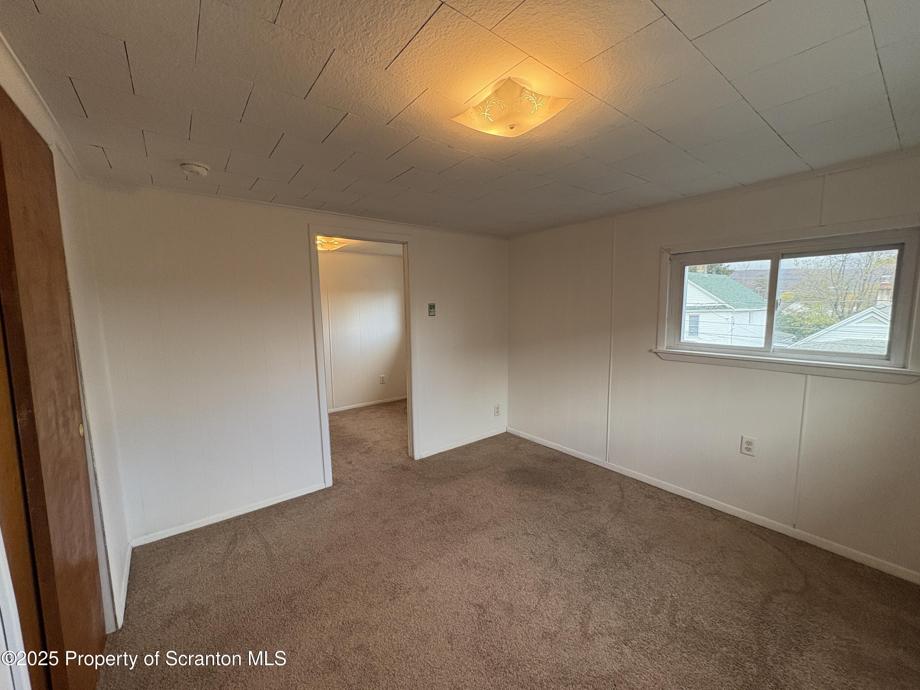 1819 Clearview Street, Unit L 109 Scranton, PA 18504 - Photo 13 of 23 an empty room with windows and entrance