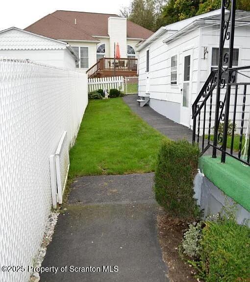 1819 Clearview Street, Unit L 109 Scranton, PA 18504 - Photo 22 of 23 a view of a house with a yard