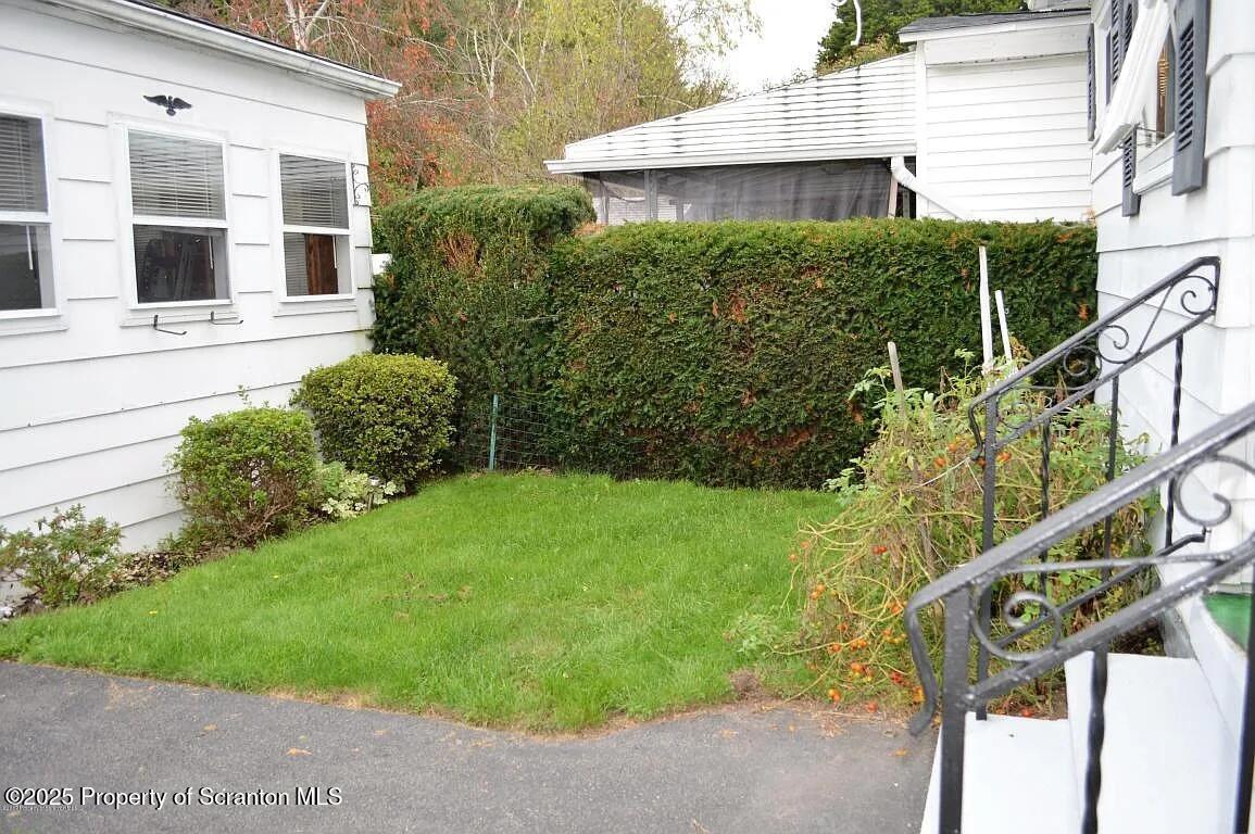1819 Clearview Street, Unit L 109 Scranton, PA 18504 - Photo 23 of 23 a view of a house with a yard