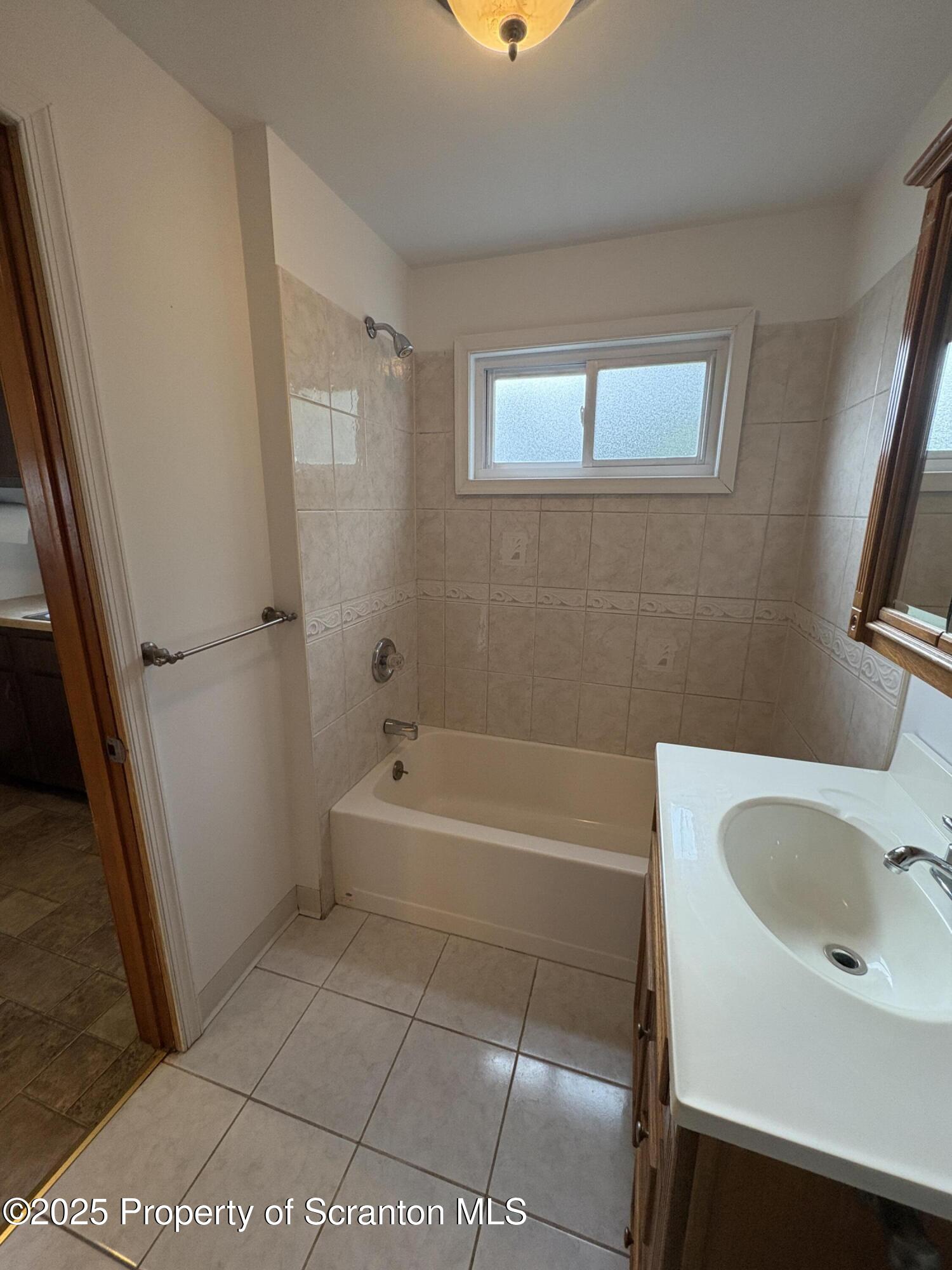 1819 Clearview Street, Unit L 109 Scranton, PA 18504 - Photo 5 of 23 a bathroom with a bathtub sink and toilet