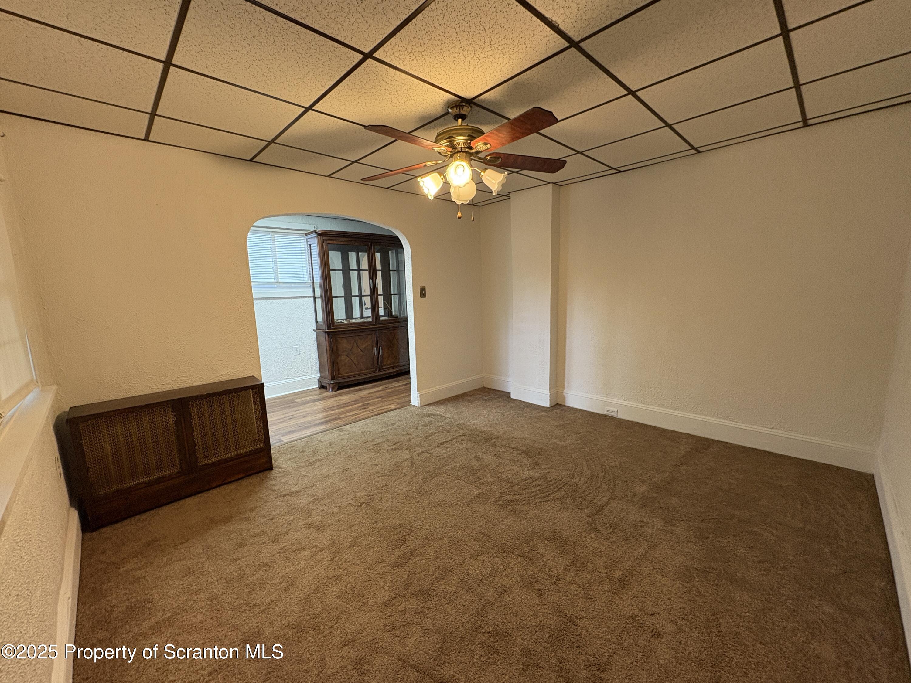 1819 Clearview Street, Unit L 109 Scranton, PA 18504 - Photo 6 of 23 a view of a livingroom with a ceiling fan and window