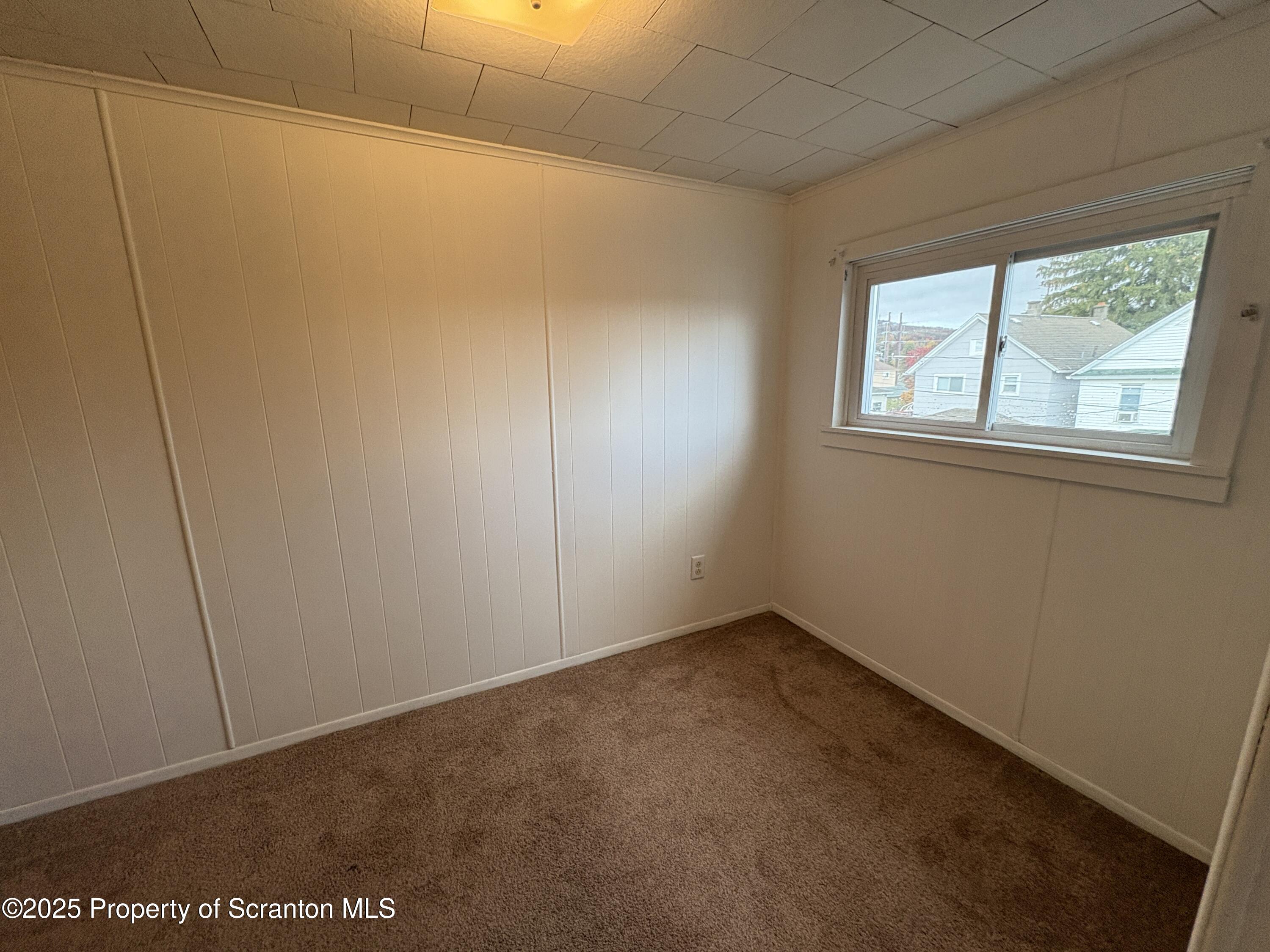 1819 Clearview Street, Unit L 109 Scranton, PA 18504 - Photo 10 of 23 a view of an empty room with a window