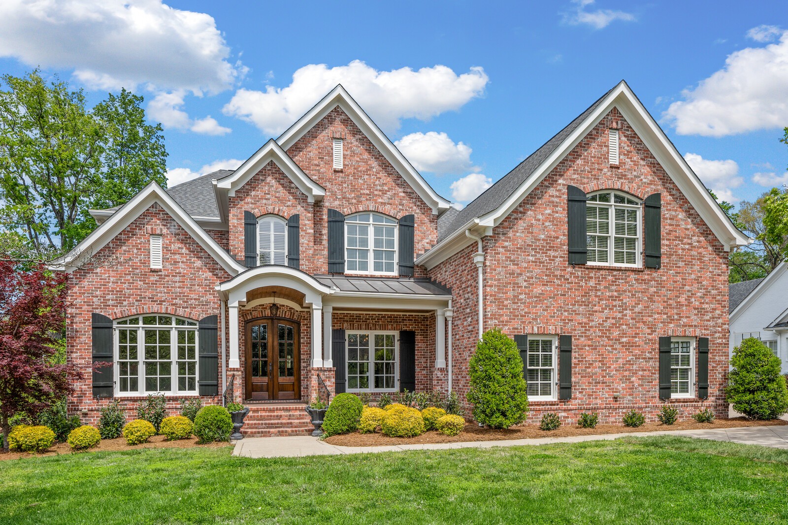 front view of a house with a yard